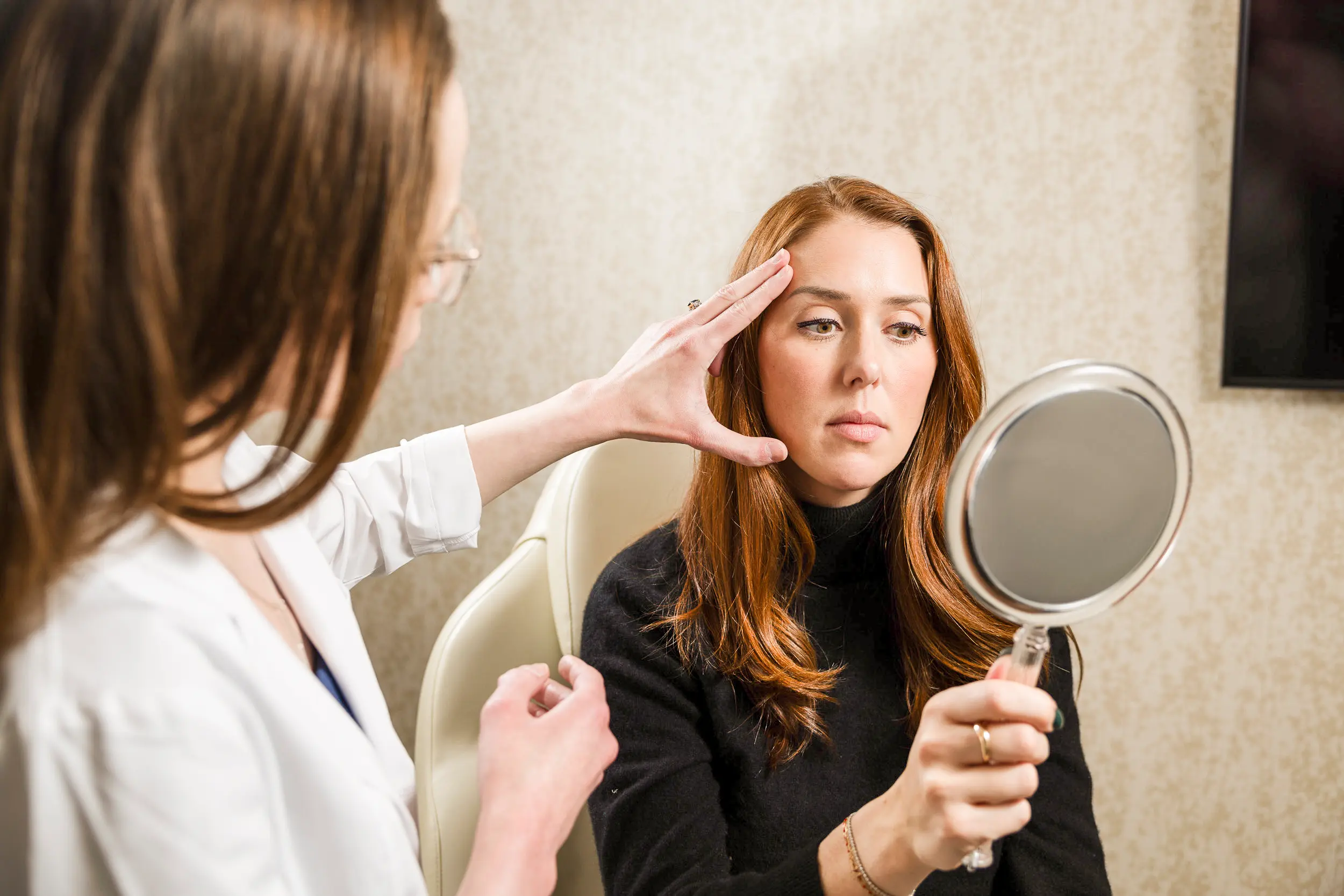 Patient consultation for face and neck lift surgery at IRIS Aesthetics