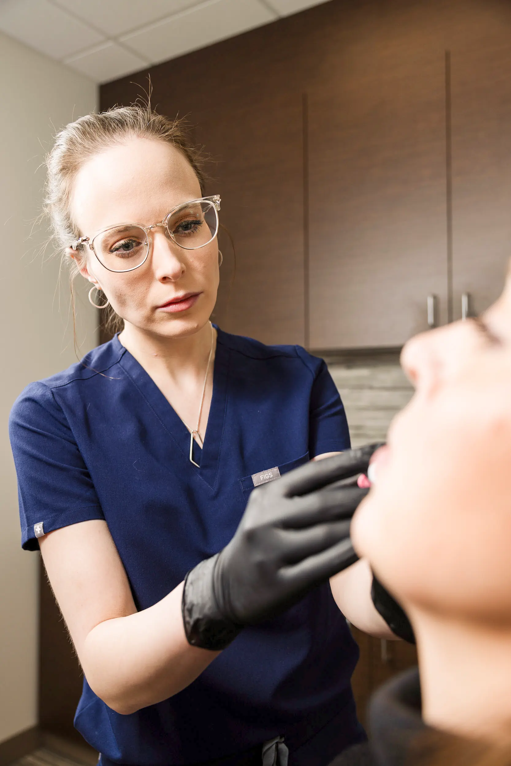 Adrianna Jensen, MD performing dermal filler injections at IRIS Aesthetics